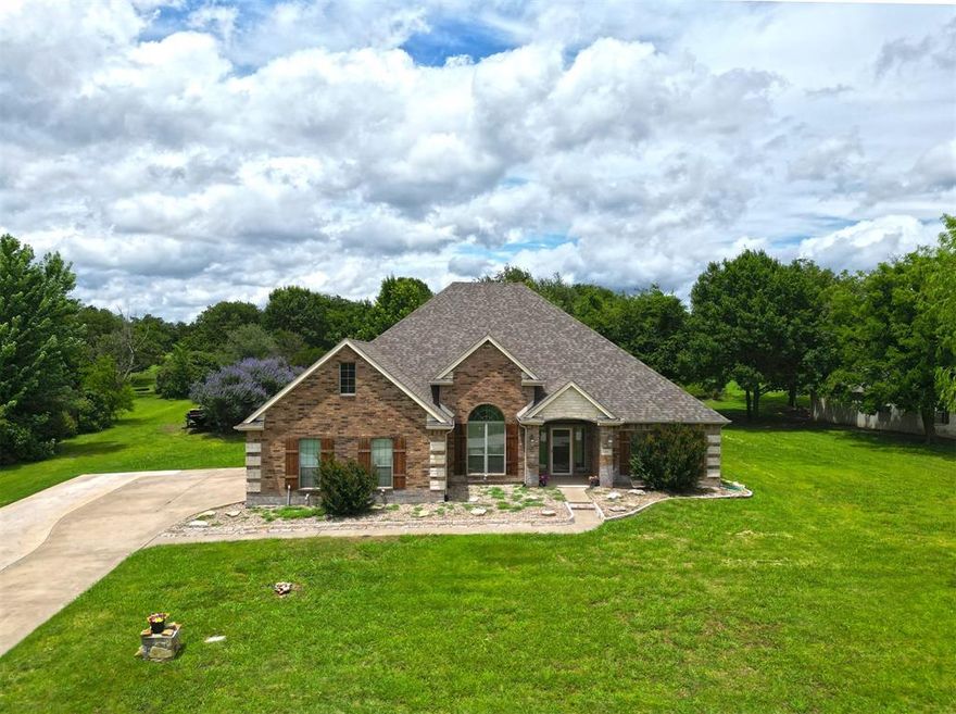 Welcome to this stunning 4-bedroom, 3-bath home nestled on 1.3 acres in desirable North Star Crossing. Step through the spacious entryway into an elegant formal dining room—perfect for entertaining. The kitchen is a chef’s dream, featuring granite countertops, a large island, stainless steel appliances, and a charming bay window in the breakfast area. Crown moulding adds a refined touch throughout, complemented by rich wood and tile flooring, with brand-new carpet in the bedrooms. Large living room features a wood burning fireplace.  Enjoy your mornings or unwind in the evenings under the expansive covered patio, complete with a ceiling fan and lighting—an ideal setting for sipping coffee or hosting guests. The roof was replaced in 2023. This home combines luxury and comfort in a serene, spacious setting.