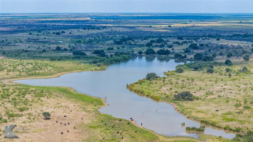 Boasting the 20 plus acre Cooper Lake, and a dozen other tanks stocked for fishing, this property is a cattleman’s or hunter’s, and fisherman’s dream. Two seasonal creeks with deep holes, which hold water year-round, traverse the property to feed all the water features. Bass, crappie, perch, and catfish flourish! Plenty of acres of cleared grasslands for grazing and several more with oak, mesquite, hackberry, and elm coverage for phenomenal hunting. Easy access off-highway US 380 (just minutes from Throckmorton) makes a quick commute from the DFW, Lubbock, Midland, and Abilene areas. Throckmorton County is known for trophy white-tailed deer, Rio Grande turkey, dove, and hogs. It’s one of the few remaining places that provide natural habitat for quail - a rare find these days! Surrounded on three sides by a very large ranch that doesn’t allow hunting, all the habitat on Cooper’s Lake ranch has been well protected. A quail hunter’s house offers two beds and one bath. A large barn and other sheds provide coverage for equipment and cattle. Good working pens and numerous traps surround the barn. Electricity is available throughout the ranch via Fort Belknap Electric Co-Op. Rural water is available through Fort Griffin Rural Water Supply. One-half of the producing minerals are available with an acceptable offer.