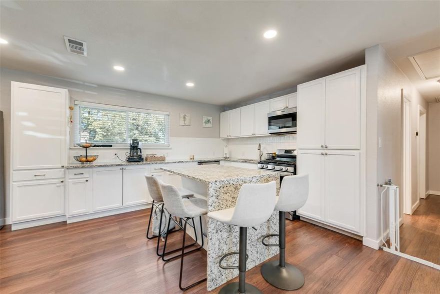 Discover this stunning 3 bedroom, 2 bath home in the heart of Hurst, located within the highly sought after HEB school district. Perfect for first time homebuyers or investors, this thoughtfully updated residence offers comfort, style, and a fantastic layout. The dedicated office can easily serve as a third bedroom, adding valuable flexibility to the floorplan. Step inside to find fresh flooring and paint throughout, along with a striking accent wall in the living room that truly elevates the space. The gorgeous chef’s kitchen is a dream come true, featuring stainless steel appliances, a center island, granite countertops, and abundant counter space, ideal for cooking and gathering. The open concept design creates a seamless flow for entertaining guests. The primary suite offers a peaceful retreat with a beautifully updated en suite bathroom. Additional highlights include a large utility closet with washer dryer hookups and an absolutely massive backyard, one of the largest lots in the area, perfect for outdoor activities, gardening, or future expansion. Conveniently situated near major highways, shopping, parks, and nature trails, this home delivers both comfort and accessibility. Don’t miss your chance to make it yours!