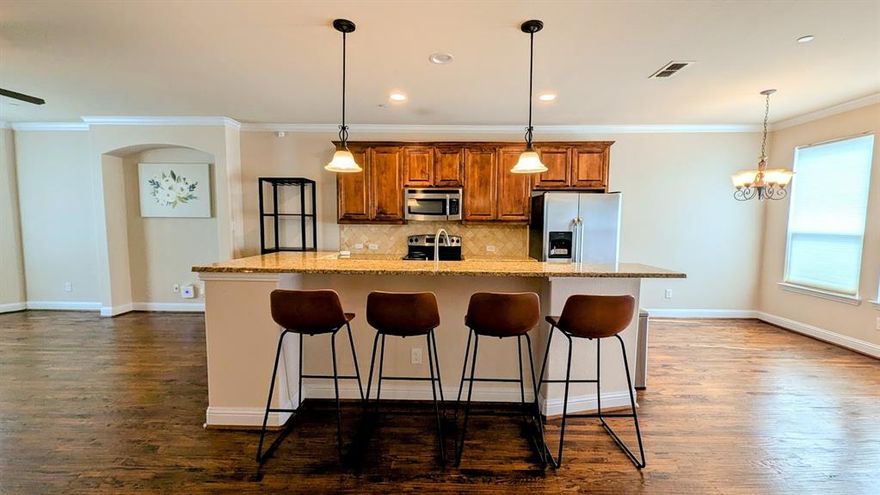 Stunning Brownstone-Style Townhome in the Heart of Lewisville, TX

Welcome to a beautifully maintained and upgraded 3-bedroom, 2.5-bath townhome with a epoxy coated 2-car garage, perfectly situated in the vibrant heart of Lewisville. This elegant Brownstone-style residence offers luxury living with a thoughtfully designed floorplan and high-end finishes throughout.

Property Features:

Bedrooms-Bathrooms: 3 bedrooms, 2 full baths, 1 half bath

Garage: Epoxy Coated Attached 2-car garage

Upgrades: Designer light fixtures, custom paint, hardwood floors, upgraded carpet, granite countertops, and stainless steel appliances

First Floor: Private bedroom with full en-suite bathroom and access to the garage

Second Floor: Spacious living and dining areas, gourmet eat-in kitchen with walk-in pantry, and a balcony 

Third Floor: Expansive primary suite with walk-in closet and additional built-in closet, large master bath, third bedroom or study, and laundry area

Enjoy an abundance of natural light thanks to the bright, open floorplan. The enclosed front yard with elegant wrought iron fencing adds curb appeal and a sense of privacy. 

Located with easy access to dining, shopping, major highways, and everything Lewisville has to offer, this home is a rare find.