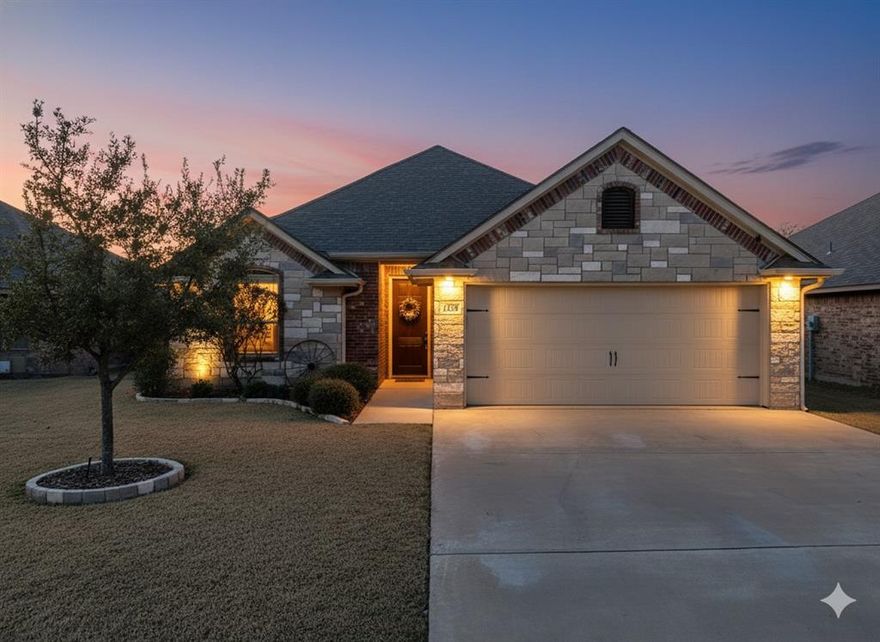 Beautiful one-owner 3-bedroom, 2-bath home located in the desirable Main Place addition in the Acton area of Granbury. Built by highly regarded local builder Walter Hardin, this well-maintained home features numerous upgrades throughout. The spacious living room offers vaulted ceilings with wood beams, gorgeous tile flooring, and a stunning stone fireplace with a wood mantel. The kitchen showcases granite countertops, pantry, stainless steel appliances and solid wood cabinetry. The hall bath features attractive stone accents and elegant arched details. A split-bedroom floor plan provides privacy, with two secondary bedrooms and a full bath separate from the primary suite. The primary bath includes beautiful stonework, a soaking tub, dual vanities, and a walk-in closet. The backyard is fully privacy-fenced and backs up to the green space. The front yard is nicely landscaped and treated regularly. The gutters and the roof were replaced in 2023. This home has been meticulously cared for and is truly a must-see! All information deemed reliable but not guaranteed; buyer and buyer’s agent to verify all information.