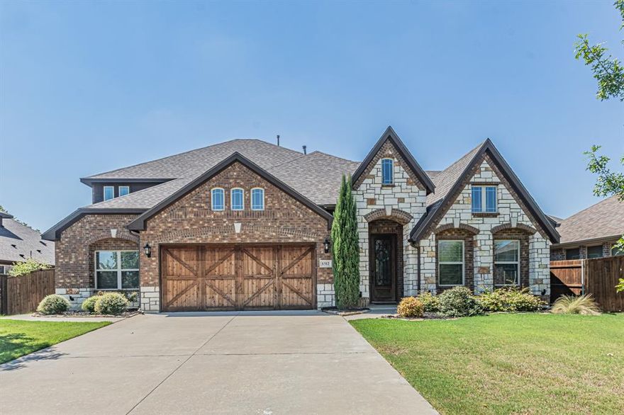 Exquisite home in Plantation Subdivision with upgrades and special amenities galore! Enter into a rotunda with views of the beautiful handscraped wood floors throughout most of bottom floor. Formal dining area is close to living & very open, guest rooms also on bottom floor are large! Grand Living area with vaulted ceilings, stained beams, WBFP with gorgeous stonework, open to kitchen area. Kitchen has breakfast bar, large pantry & gas cooktop! Master is oversized with electric shades, separate shower, jacuzzi tub! Bonus suite on first floor with closet currently being used as craft sewing room! Upstairs is bonus room, bedroom & full bath. This is a great Multigenerational home. You will love relaxing on your extended covered patio with beautiful landscaping and a workshop with electricity! Two separate attics with storage areas.  Large lot, upgrades, this is the one.