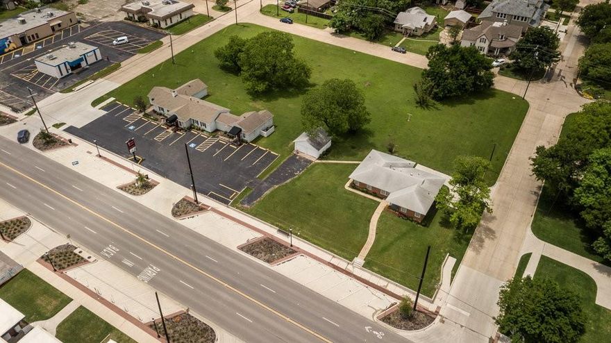 1.72 Acres of land that make up a city block in historic downtown Mansfield! The property currently houses 2 buildings, 306 and 316 S Main. 306 S. Main is 1730 SF with 3 bedrooms & 2 baths; 316 S. Main St is an office building with approximately 2,336 SF, 2 units that are occupied by tenants. This area is prime for development with many exciting, approved projects coming in next door and down the Main St. corridor. The city would love more density in the area and this area is zoned D3 UC. Approx. 300' of road frontage on Main St, 15 dedicated parking spots plus public parking on Main St!  Do not disturb the tenants, shown by appointment only.