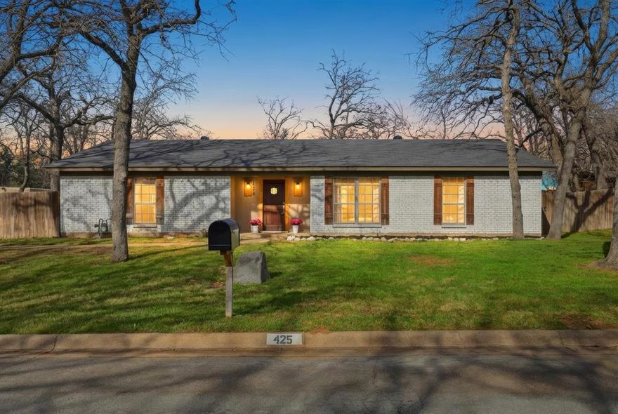 Stop your search—this is the incredible find you’ve been waiting for! This fully reimagined single-story masterpiece sits on a massive lot and blends high-end modern luxury with a warm, rustic soul. The moment you step inside, the open-concept layout draws you toward a show-stopping kitchen built for entertaining. It’s decked out with exotic granite, a 4-burner gas range with a custom vent hood, and a huge social island. Best of all, the cabinetry is upgraded with whisper-quiet, soft-close hardware for that premium, high-end feel. The design is as smart as it is beautiful; a stylish barn door slides open to reveal a massive walk-in pantry (with space for a second fridge!) and a utility room large enough to house two full sets of washers and dryers. Durable wood-look tile and sustainable bamboo flooring flow into the private quarters, including a primary suite featuring a spa-inspired bath with double sinks. Two additional bedrooms provide ample space, while a second full bathroom features dual vanities and a shower-tub combination for maximum functionality. Outside, the property is an absolute playground. You can host summer BBQs on the stone patio under the shade of mature trees or utilize the huge gated yard for pets and play. For the weekend warrior, the parking is a total game-changer: the driveway, garage, and carport are specifically sized to accommodate your RV or boat. Perfectly positioned for quick commutes via HWY 377 and 114, you’re just minutes from the best dining and shopping Southlake has to offer!