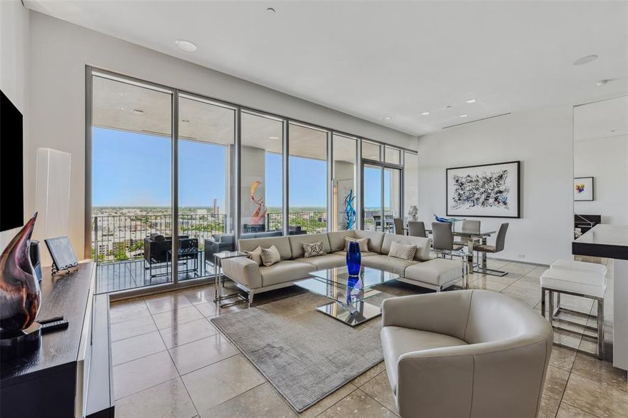 Located in the heart of the Dallas Arts District - recently named the Best Arts District in the country for the second year in a row!   This sleek, modern condo at One Arts Plaza is a masterclass in contemporary elegance, bathed in natural light and perfectly designed to highlight your fine art collections.  The kitchen features an expansive breakfast bar and seamlessly flows into the open living and dining areas.  Step out onto the large, covered balcony from the kitchen, living area, or primary bedroom, creating a harmonious space for both indoor and outdoor entertaining.  The primary suite is true retreat boasting a spacious bathroom and a generous walk-in closet.  The versatile second bedroom, ideal for both work and rest, includes a thoughtfully integrated workspace and a convenient Murphy bed.  Located in the vibrant Arts District, you'll be just moments away from The Winspear Opera House, Meyerson Symphony Center, Moody Performance Hall, the Dallas Black Dance Theatre, and Booker T. Washington High School for the Performing and Visual Arts.