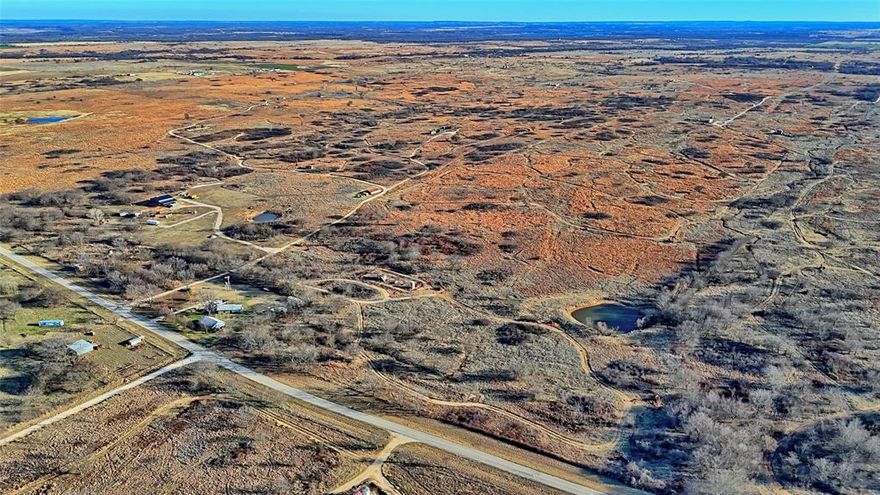 479-acre ranch featuring lush native grasses and bluestem, ideal for grazing cattle. The property includes four well-situated ponds providing reliable water sources for livestock. Property has road frontage on two sides. Seller is a licensed Real Estate Broker.
