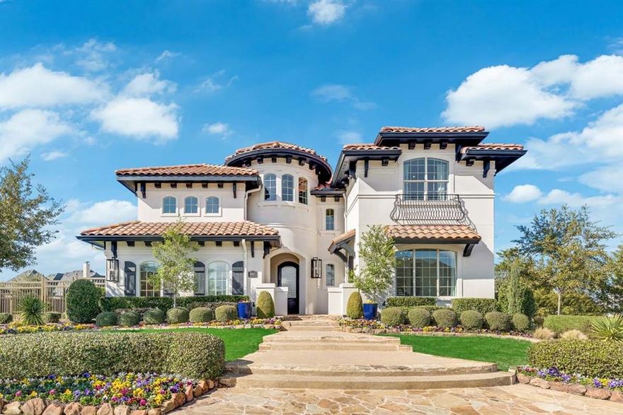 Fabulous Grand Homes Model Home For Sale on Corner lot. Prestigious GATED neighborhood w manned security guard, community center & winding trails along treed creek. Spanish styled home with front courtyard, barrel tiled roof & large backyard ready to entertain with pool, waterfall & BBQ. Home is loaded with custom wood work & built ins. Stunning entry & step up living with floor to ceiling wood shelves. Cozy formal dining & full oak stairs with wrought iron. Vaulted Family Room has fireplace with full wall of tile and wine bar. Gorgeous Master suite with free standing tub, frameless glass shower & separate vanities. Downstairs Guest Suite. Kitchen has slab tops, commercial range with double ovens, stainless steel appliances, fridge included, Shaker cabs.  Enormous upstairs has huge gameroom, snack bar, game table area, media room & 3 large bedrooms. Energy Star with R38 & 16 SEER