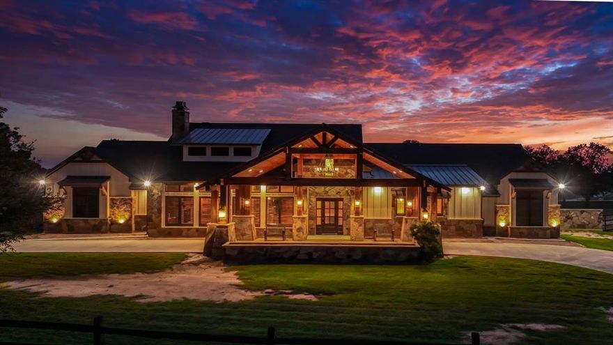 Welcome to 117 Hansma Way, a breathtaking custom ranch estate in the gated Bar H Ranche community of Weatherford. Set on 2 ACRES of picturesque Parker County land with mature trees and full PIPE fencing, this property captures the heart of horse country living with true Big Texas energy. Every aspect was crafted with care and precision. Meticulously maintained and still presenting like new, this retreat is designed for comfort, beauty, and peace of mind. The residence offers nearly 4,809 square feet with 4 bedrooms, 4 full baths, and 1 half baths, plus a full bath in the 30×40 workshop. Interiors showcase hand-scraped hickory wood floors, travertine tile, masonry fireplaces, and onyx lighting. HEATED bathroom floors add luxury, while wide hallways, handicap rails, and wheelchair-friendly design provide accessibility. A private MOTHER-IN-LAW SUITE with private living room offers space for guests or multi-generational living. The gourmet ENTERTAINING kitchen is both elegant and practical, featuring an oversized island, double ovens, warming oven, gas stove, two dishwashers, two sinks, wine cooler, and walk-in pantry. Built with integrity, the home includes 2x6 insulated walls, insulated ceilings and interior walls, Class 4 hail-resistant shingles, a 40–45 kW Generac GENERATOR, 1,000-gallon buried propane tank, three zoned HVAC units, and a tornado-rated safe room with 14-gauge steel walls. Even the garages, attic, and workshop were insulated and finished with care. Two oversized 2-car garages with epoxy floors, EV charger, custom storage, and a porte-cochere are paired with a 30×40 insulated WORKSHOP with full bath. Outdoor living shines with a covered kitchen including grill, pellet smoker, refrigerator, sink, and burner, plus an expansive patio with fireplace. Every inch of this estate reflects craftsmanship, foresight, and pride of ownership, offering a rare opportunity in one of Weatherford’s top small-acreage luxury communities. More details at 117hansmaway.info