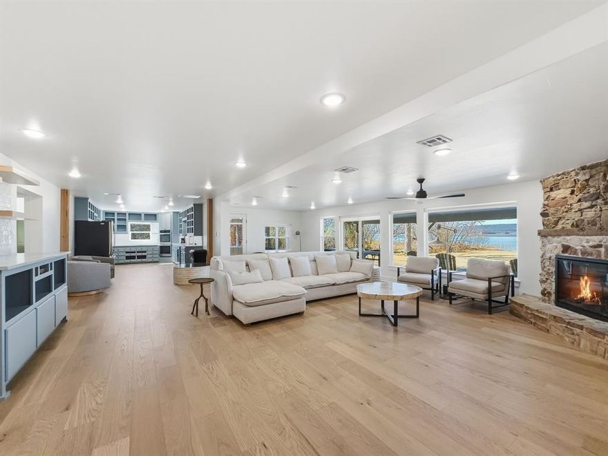 WATERFRONT WITH DOCK! FULLY RENOVATED, FULLY FURNISHED, waterfront retreat offering the perfect blend of modern comfort and relaxed lakefront living. Designed with an open concept layout, the spacious living, kitchen, and dining areas flow seamlessly together, creating an ideal space for entertaining and gathering with family and friends—all while capturing peaceful water views.

The main level features three well-appointed bedrooms and beautifully updated bathrooms, while the expansive secondary living area provides incredible flexibility and the ultimate bunk room! 

Step outside to enjoy the large, grassed backyard that gently meets the water, offering plenty of room for outdoor activities and lakeside entertaining. Your private dock with over 230 ft of grandfathered walkway makes enjoying the water effortless, whether boating, swimming, or fishing!

Tucked away in a private setting with no HOA restrictions and excellent rental potential, this property presents a rare opportunity to own a fully renovated, turn-key waterfront home ideal for personal enjoyment, investment, or both!