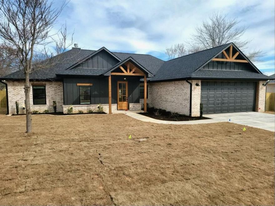 Discover this brand new elegant and modern home featuring a cozy wood-burning fireplace in the living room, perfect for tranquil evenings. This stunning property includes 4 bedrooms, with the primary bedroom having a large walk-in closet and large soaking tub. Set in an area renowned for its harmony with nature, this home is located near the lake—perfect for fishing, boating, or simply unwinding by the water. Enjoy the advantages of lake proximity amid the comforts of contemporary design. Your sanctuary awaits!