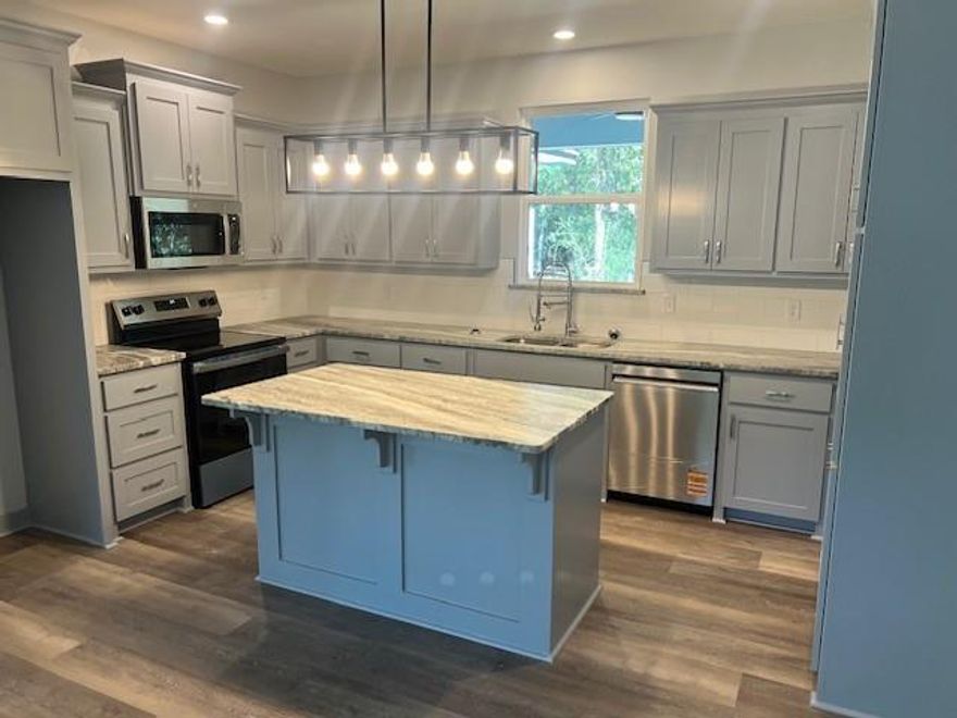 New construction opportunity in the desirable gated community of Holly Lake Ranch! This 3-bedroom, 2-bath home is currently under construction and offers a rare chance to personalize your East Texas retreat before completion. Surrounded by beautiful pine and oak trees, the property features a covered front porch along with a screened-in, covered back patio—ideal for taking in the peaceful, wooded surroundings.

The planned interior includes durable LVP flooring, an electric fireplace, and a well-designed kitchen with granite countertops, stainless steel appliances, and modern finishes. Granite surfaces will also be featured in both bathrooms for a cohesive, upscale look.

A long-lasting metal roof and an attached 2-car garage add practicality and value. Located within Holly Lake Ranch, you’ll enjoy access to community amenities including golf, lakes, walking trails, and resort-style recreation—all within a secure, private setting.

A great opportunity to own a brand-new home and make it your own as construction progresses!