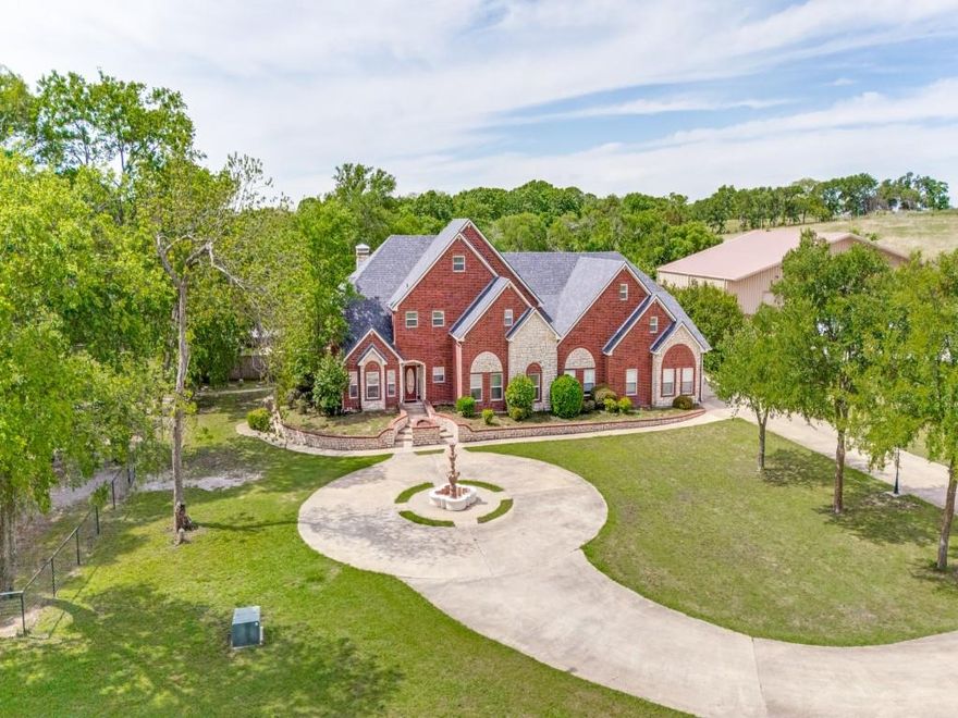 This magnificent estate is set on the backdrop of 4 lush acres and delivers a scale of living rarely found. This paradise awaits your decorative vision and personal finishing touches to make it entirely your own. The spacious kitchen features an abundance of customs cabinets, generous walk-in pantry, a large center island, and a sun-drenched breakfast nook. Multiple living spaces stand ready for occasions that call for time with loved ones and entertaining. Warmed by a handsome fireplace, and framing sweeping views of the backyard oasis, the den is set off of the kitchen. The primary suite offers a true retreat with additional squre footage for a sitting area, two walk-in closets, a private deck that overlooks the estate, and a huge primary bathroom with a soaker tub. Desired split floorplan with a secondary primary suite on the main floor. The expansive game room, and hideaway nook with a loft, offer room enough for a dedicated home gym or kids play area, and features a built-in wet bar that ensures fun and entertainment for all. Your outdoor paradise awaits — a shimmering pool, relaxing hot tub, and an elegant gazebo capture the view across the pond. Resident geese and ducks call the private, bass-stocked pond their home, and set the serene landscape. A separate income-producing guest home with full bath, kitchen, and a 1 car garage is on the property. Enjoy hosting and entertaining in the barndo-style event venue equipped with a kitchen, bathrooms, and an outdoor kitchen. An impressive 9 car garage provides room for the car enthusiast or for additional storage space. Van Alstyne boasts highly rated schools and a welcoming community that offers entertainment, famers markets, shopping, and dining. With no HOA, you can create your own family legacy- build your venue business, plant a garden, or even start a working farm. Get ready to enjoy the good life on this charming and one of a kind estate!
