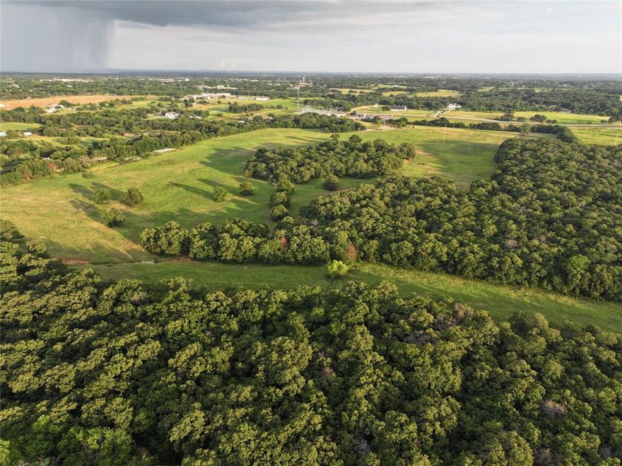 Explore this exceptional 95 plus acerage of unimproved property, the ideal site for your dream estate.  Located just minutes from downtown Aubrey, known as Horse Country USA. The property is just minutes from downtown Aubrey and Denton, Texas, providing easy access to I35 for those who commute to the DFW Metroplex.  Nature lovers will appreciate its proximity to Lake Ray Roberts, offering a variety of recreational activites like fishing, boating, camping, hiking and horse back riding trails.  Situated outside the city limits and within the ETJ , this expansive tract offers a tranquil setting with rolling terrain, and ponds,  while remaining close to urban amentities.  The land includes multiple parcel ID numbers, and please note the seller will not divide the property.  Dont miss this rare opportunity to create the estate of your dreams in a location that captures the essence of Texas living.Multiple Parcel Id's #51549, 183753, 52469, 51564