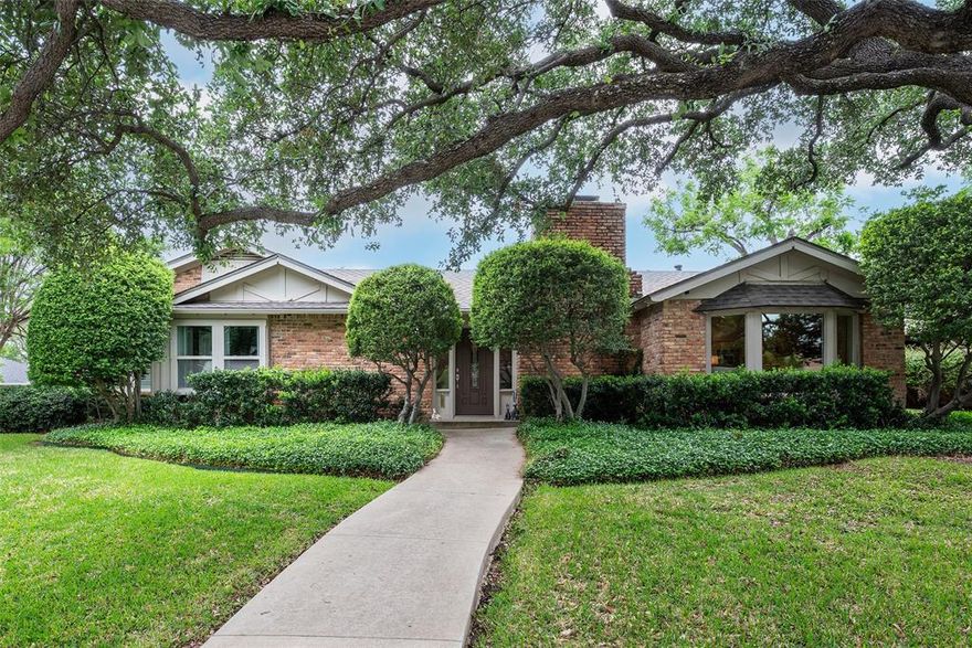 A MUST SEE to fully appreciate! Slightly angled atop a 0.25 acre corner lot, 100 ft. by 130 ft, currently remodeled and meticulously maintained, this 1970, one story traditional, is the definition of home. With its gabled rooftops and large, bay front window, this beautiful brick home sits within the wide, quiet, 4 street Walnut Gardens neighborhood.  Think Midway Hollow NorthWest.  A hidden gem with ranch style homes, shaded by mature oaks and magnolias, only minutes from the best of Dallas’ private schools, shopping and dining. 4 bedrooms 2 full and one half bath, 2-car attached garage, stone fireplace, travertine floors, safe room, atrium, primary with walk-in closet & en-suite bath. 2 backyards with 8-foot board-on-board wood fencing. One yard has electric sliding gate enclosing a 2nd driveway for 3rd car or RV. Too many pluses to list.