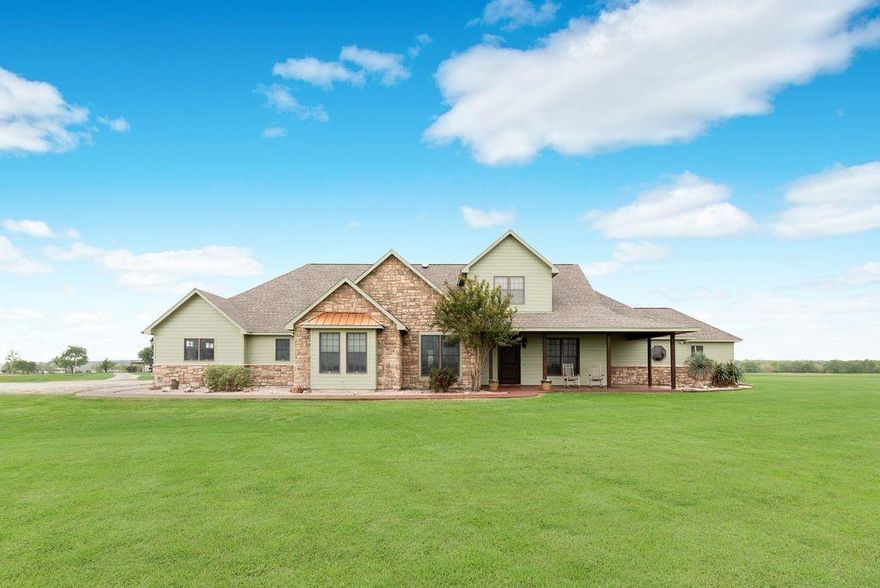 Enjoy FISHING, FOUR-WHEELING, & FANTASTIC SUNSETS at your very own HOME!! This AMAZING property is beautifully situated on 49+ fenced acres and features 2 stocked ponds (Bass & Perch), a 40x40 Metal Barn, a 20x50 RV Cover with full hookups, an 18,000 gallon in-ground pool with a waterfall feature, and a STUNNING 4,089 square foot 4 bedroom-4 bathroom HOME. The WOW FACTORS start at the front exterior of the house with the stacked stone accents, the Copper window awning and the covered porch where you can sit, relax & enjoy pond views. Once inside you will be instantly impressed with custom features including crown molding, built-in cabinetry, & reclaimed solid wood floors. A generous dining room and private study are located off the welcoming entryway. An open concept layout then leads to the cozy living room with a stone fireplace and an adjoining chef's kitchen that offers 42 inch cabinets, granite countertops, tumbled marble backsplash, gas range and a custom island with a Mesquite Wood countertop. Just off the kitchen is a massive sunroom with tons of windows that overlook the property's acreage. The primary bedroom is located downstairs and includes crown molding and plush carpet. The primary bathroom is a spa-like retreat with a jetted tub, separate vanities, custom shower and an oversized closet with built-in cabinetry. Upstairs the wow factors continue with a dedicated media room, large office space and oversized bedrooms. The outside spaces are just as impressive and include a fabulous Cabana with fireplace, fishing pier, and a new architectural shingle roof. The 3-car garage has epoxy floors and plenty of storage while the 40x40 barn has 15' covered extensions on either side. There is also an AG Exemption for hay cutting. Conveniently located in Waxahachie and only minutes from Dallas, this ONE-OF-A-KIND property provides a Rare Opportunity to live the country life on your own peaceful ranch but still be close enough to enjoy the city life when you want to!
