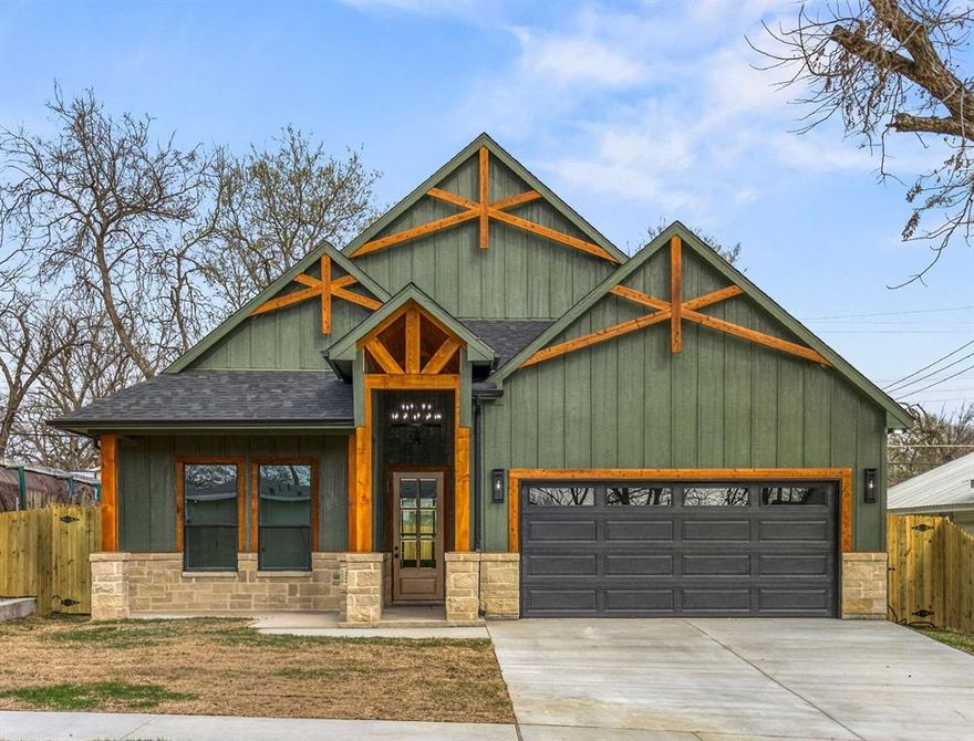 Welcome to this stunning new construction home just minutes from the historic Fort Worth Stockyards and vibrant Downtown. This beautifully designed home offers a perfect blend of modern style and rustic charm with eye-catching exterior details, rich wood accents, and impressive curb appeal. Step inside to an open and spacious floor plan featuring soaring ceilings with custom wood beam details, designer lighting, and large windows that fill the home with natural light. The living area flows seamlessly into a chef-inspired kitchen showcasing custom wood cabinetry, a large waterfall island with quartz countertops, built-in appliances, and stylish pendant lighting—perfect for entertaining. The home also features a thoughtfully designed layout with spacious bedrooms, modern finishes, and elegant touches throughout. The primary suite offers a relaxing retreat, while the additional rooms provide flexibility for guests, a home office, or growing families. Located in a prime Fort Worth location with easy access to dining, entertainment, and shopping, this home offers the perfect opportunity to enjoy modern living just minutes from some of the city’s most iconic destinations.