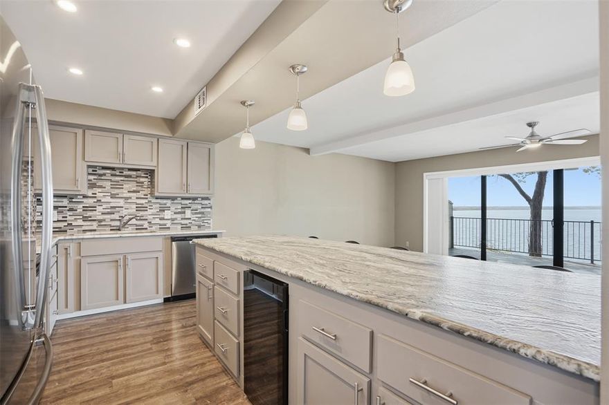 Nestled within the exclusive, amenity-rich community of DeCordova Bend Estates (DCBE), this stunning two-story condo offers a premier waterfront lifestyle. Featuring three spacious bedrooms and three full bathrooms, this home provides an open-concept kitchen and living space perfectly designed to capture breathtaking lake views. The home is both functional and stylish, with vinyl plank flooring flowing through the main living areas, complemented by brand-new, cozy carpet in the bedrooms. The kitchen is a chef's dream, boasting an abundance of granite countertops with a distinct leathered finish on the large island, which also provides convenient breakfast bar seating. It comes fully equipped with stainless steel appliances and includes a wine fridge, making it perfect for entertaining. In the living room, you can cozy up to the wood-burning fireplace while still taking in those incredible views. Sliding glass doors lead out to a generously sized balcony, significantly extending your outdoor living and entertaining space. For convenience and access, the property includes a covered boat slip for easy lake enjoyment, a 2-car garage, and an additional 1-car carport. Furthermore, living in DCBE means living the vacation life every day. The community offers an impressive array of amenities, including a championship golf course, tennis and pickleball courts, volleyball, direct lake access, a community pool, and a vibrant clubhouse. This is more than a home—it’s a lifestyle. Don't miss your chance to own a piece of paradise in DCBE!

HOA fee breakdown: DCBE dues 308.61 monthly. Condo Dues 275 monthly (+ 195.63 for exterior insurance that can be paid monthly or annually). Condo dues cover yard, water, common area maintenance. Trash is covered by DCBE. DCBE has $6500 initiation & $3500 admin fee=$10,000.