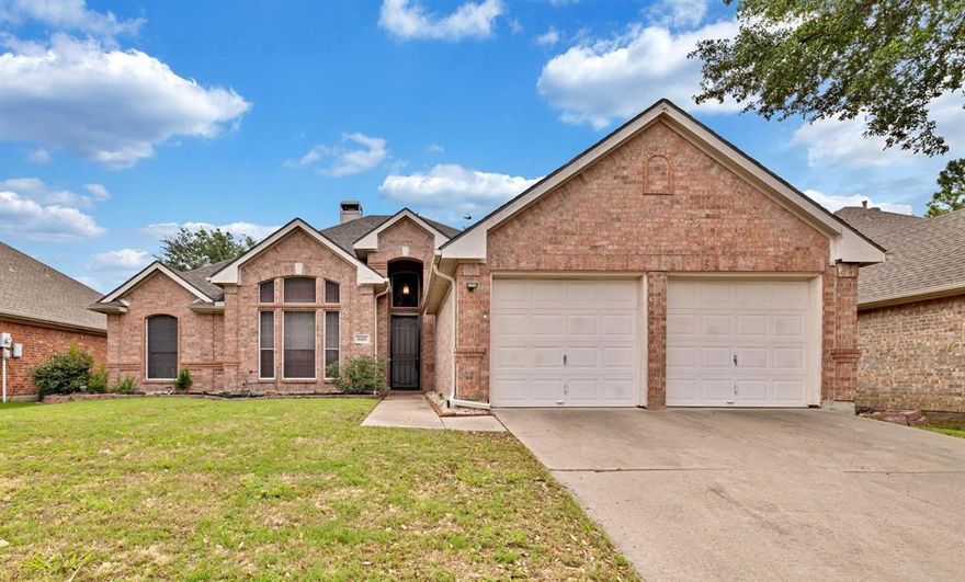 SWEET SURPRISES AWAIT!  This home features 3 bedrooms + a home office + a formal dining room.  This adds value and flexibility to this home.  Kitchen has been updated with granite countertops, natural finish on cabinets, and stainless steel sink and appliances. Small built in desk adjacent to the kitchen will come in handy.  Laminate plank flooring looks nice and it's easy to maintain.  Open style design with kitchen and living area, which features a gas fireplace equipped with gas logs and a full wall of windows overlooking the private back yard.  Split bedroom arrangement provides privacy.  Primary bath includes dual sinks, jetted tub and a separate shower.  There is a lot to love here and room to grow.  Bonus:  It's convenient to Tarrant County College and Hwy 360...
