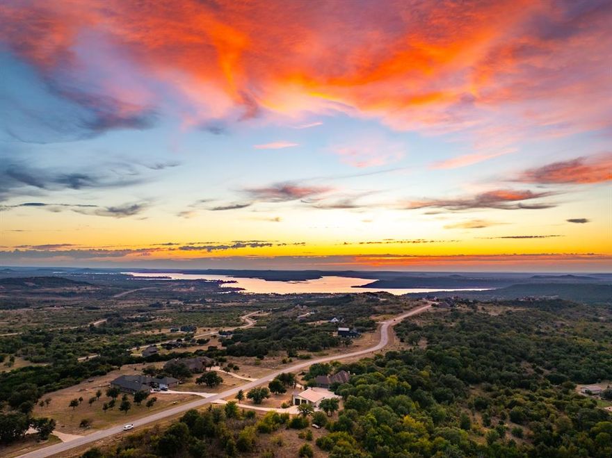 Remarkable 4 acre property located inside The Hills Above Possum Kingdom has so much to offer!  Elegance and comfort inside combined with relaxation, nature and entertainment space outside, PLUS an oversized garage with 10 x 12 pull-through doors, room for boat storage (& more), a spacious guest suite, parking for plenty and much more! Make your plans to see this one ~ schedule your private tour soon!