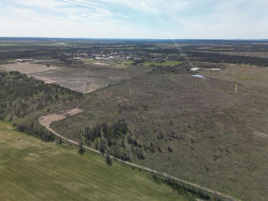 This is the last of the available land in Prairie View Estates. All land is 12,500 Per Acre, You can negotiate the acreage, but its all 12,500 per acre. Beautiful Equestrian property among many horse loving families.  Claim your touch of heaven with the freedom to build what you want from the ground up, creating your own Ag Estate.  The soil is fertile and holds water very well so build the pond of your dreams and stock it as you wish.  The water table is excellent and the water wells have quality water and good production.  Grow your own Coastal Hay.  Perrin Schools are desirable in this area and the lights of the football stadium can be seen from the pasture.  Join the community and help us find your new neighbors.  We can divide this 36 Acre Parcel into smaller tracts but not less than 11 acres in a parcel.  No mobile homes will be permitted per the deed restrictions and property is to be used for future residential and agricultural use.