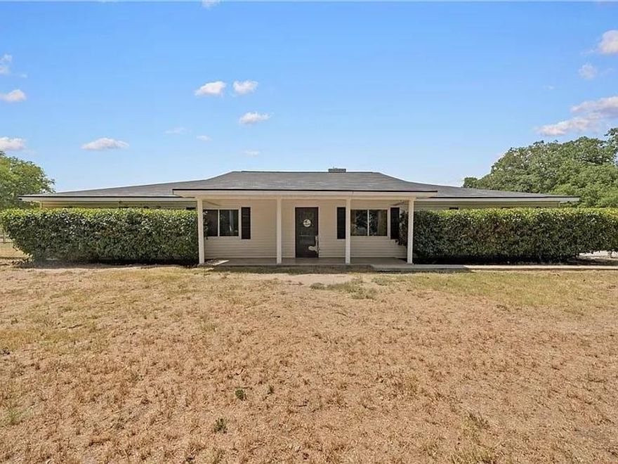 Beautiful Axtell Property with tons of charm and lots of room for family fun activities. In AXTELL school district. This home is spectacular. Country views with a sunny completely decked pool Wood burning fireplace. The garage has water access as well as electricity and holds EIGHT cars. The garage used to be a motorcycle shop. The wood burning fireplace is stunning and the centerpiece of the family room Perfect for the holidays.The property has RV parking and so many treasures.