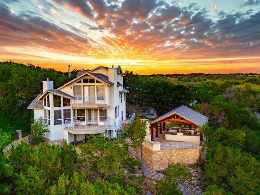 SPECTACULAR, NEWLY REMODELED, WATERFRONT 3184 SQFT LAKEHOUSE WITH DEEP WATER, DOUBLE LEVEL DOCK, Separate Media and Bunk Room, 3 Gar Garage with Guest Apt above, and All with BREATHTAKING PK VIEWS in the highly sought after Prestigious Community of GAINES BEND. This Custom Home is located on a Coveted Deep Water Cove just around the corner from The Famous Hells Gate, and it is the IDEAL PK LAKE FAMILY RETREAT. The 3bd & 3ba Main House has a Light and Bright Open Floor Plan, JUST UPDATED THROUGHOUT THE ENTIRE HOME, & Features Cathedral Ceilings, floor to ceiling Stunning Lake View Windows, all Stainless Appliances, all new Lighting, Flooring, & Cabinets, Rock Fireplace, Wet Bar, and Relaxing Patios to maximize the Breathtaking Lake Views, Sunrises and Sunsets. The current owners added a Gorgeous Custom Rock and Cedar, Chef's Dream Outdoor Kitchen, with Pellet Grill, Pizza Oven, Alfresco Flat Grill, Refrigerator, Sink, Storage and Granite Counter Seating, with an additional Living Area & Fireplace for Maximum Outdoor Entertaining & Dining, and all this is highlighted by a Waterfall that flows into a Custom Rock Gunite Wading Pool. Plus they also built a 1467 SQFT DETACHED 3 CAR GARAGE with Separate 535 SQFT APARTMENT and OFFICE Space for overflow Guests, and converted the old garage space into a 1001 SQFT MEDIA, GAME, WORKOUT & 5th Bd BUNK ROOM, however you design it. The Grandkids also love the secret Loft bedroom above the Game Room as well. Next to the New garage the Owners also created additional Parking for Guests and Trailers. Then once you walk down the rock steps on the lakeside of the house, there is a Double Level Dock that sits in 22ft of Water in the NO WAKE Cove and has two 10x28 Boat Slips with Lifts, 2 Jet Ski Ports and Kids Slides as well. On the 2nd Level there is a great Covered Dining Area with Beautiful Lake views down the Private Cove towards Hell's Gate. This is the BEST OF PK LAKE LIVING & THE ULTIMATE LAKE ESCAPE TO RELAX AND RECHARGE PK STYLE.