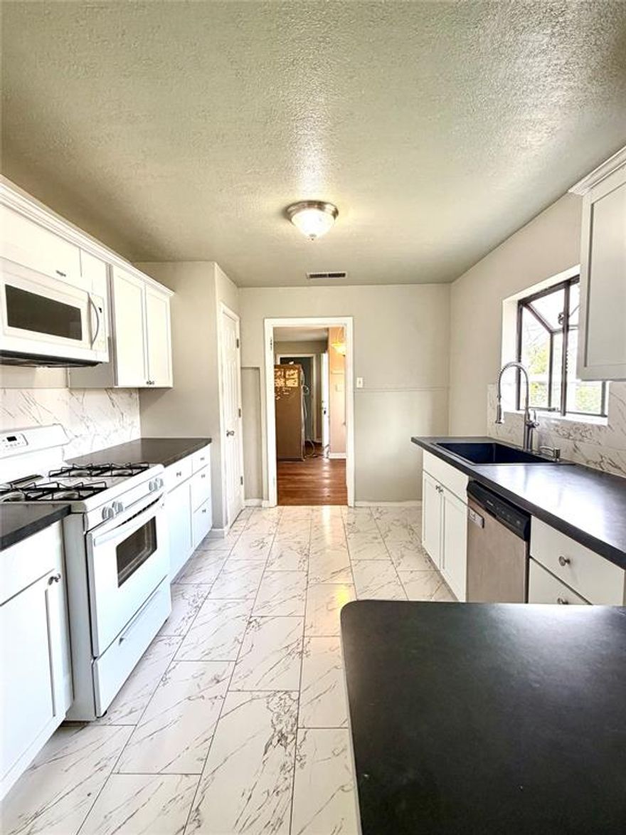 Welcome to this charming 4 bedroom, 2 bath single-family home on a cul-de-sac in a convenient Fort Worth location! This large 1,702 sq ft residence sits on a generous 8,450 sq ft lot and offers great potential for buyers ready to add their personal touch.
Step inside to find fresh updates including brand-new flooring throughout and all-new energy-efficient windows for improved comfort and lower utility bills, roof is 2023, water heater is 2022!
The layout provides ample space with four bedrooms and two living spaces —perfect for families, guests, or a home office—and two full bathrooms. Additional highlights include a storm shelter for peace of mind during Texas weather, a cozy back porch for relaxing outdoors, a carport, and two medium-sized storage units for extra organization.
While the home shines with these recent improvements, it offers opportunity for cosmetic updates to truly make it your own—think paint, fixtures, or modern finishes to boost its value even further.
Location is a major win: Just 3 miles from Hulen Mall, 2 miles from Benbrook, and a quick drive to vibrant Downtown Fort Worth. Enjoy easy access to The Shops at Waterside featuring Whole Foods, REI, and a variety of dining options.