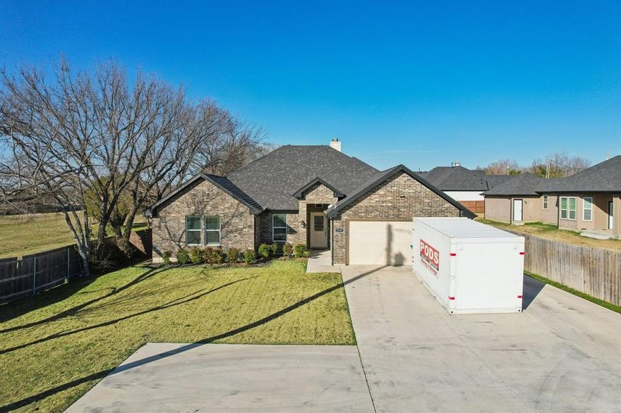 USE OUR LENDER AND RECEIVE 100% FINANCING, NO PMI, PLUS 2% OF PURCHASE PRICE CREDIT TOWARD CLOSING COSTS
Welcome to this stunning 2023 built home in Fort Worth, Texas, perfectly situated near major highways including Loop 820 and I-30 for easy access to Fort Worth, Dallas, and surrounding cities. Adjacent to a beautiful greenbelt, the property offers scenic views and a peaceful setting, creating a serene retreat right at home. Designed with modern living in mind, the home features bright, neutral colors throughout, creating a clean, inviting atmosphere that complements any style. The refrigerator, shed, and Nest doorbell convey with the property.

The open concept kitchen flows seamlessly into the spacious family room, making it ideal for both everyday living and entertaining. A cozy wood burning fireplace serves as a beautiful focal point in the family room, adding warmth and character. Step outside to enjoy the large, spacious deck overlooking the generous yard, perfect for relaxing, hosting gatherings, or enjoying the nearby greenbelt setting. The property also includes a two car attached garage plus an additional parking space out front, offering convenience for guests or extra vehicles. This move in ready home combines comfort, style, outdoor living, and an unbeatable location.