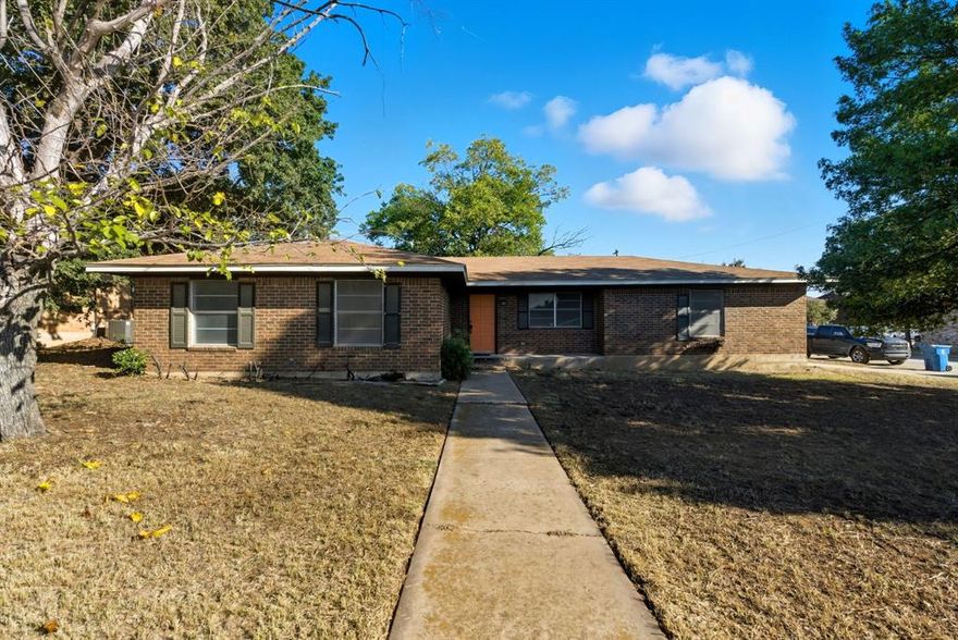 Spacious 3-Bedroom Home on Corner Lot with Extra Garage or Workshop

Welcome to this well-maintained 3 bedroom, 2 bathroom home offering 2,064 sq. ft. of living space on a desirable corner lot. Built in 1980, this property combines comfort, functionality, and a convenient location directly across from Cisco Junior High.  This house was remodeled around 2019 and a new roof was installed around that time.  

The home features a generous living area with rich wood flooring, neutral finishes, and a painted brick fireplace as the centerpiece. The updated kitchen is equipped with granite countertops, subway tile backsplash, stainless steel appliances, and ample cabinetry, making it both stylish and practical. Bathrooms have been tastefully renovated, including granite vanities and a tiled tub and shower surround.

Outside, you’ll find a 2-car attached garage plus an additional detached garage or workshop with alley access—perfect for extra storage, hobbies, or projects. The corner lot provides great curb appeal and additional space.

 This move-in ready home presents a fantastic opportunity for buyers seeking quality and convenience in a desirable location.