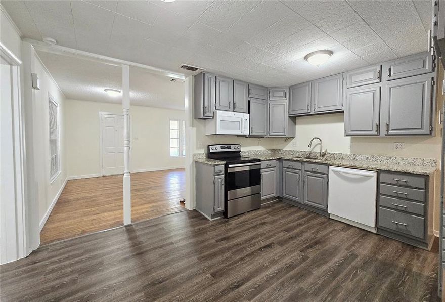 Nestled in the heart of Commerce, just minutes from Commerce ISD campuses and East Texas A&M University, this charming 3 bedroom, 1 bathroom home blends comfort and convenience. Inside, you'll find a spacious living room that flows seamlessly into an eat-in kitchen featuring granite countertops. A bright bonus room off the kitchen is ideal for use as an office or formal dining area, and a dedicated laundry room adds everyday ease. Step outside to your spacious backyard-complete with a privacy fence for added seclusion-plus a one-car garage and exterior storage room perfect for tools or seasonal gear. $1,200 deposit and pets welcome with pet fees.