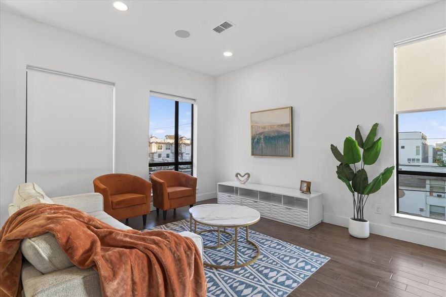 Experience modern city living at its finest in this stunning three-story townhome built in 2017 with NO HOA. Offering over 2,100 square feet of exceptional living space, this contemporary home features sleek designer finishes throughout, including bold hardwood floors, ease of convenience with a central vac & dumb waiter, stylish tile, and an abundance of windows that flood the home with natural light. The gourmet kitchen is beautifully appointed with white shaker cabinetry, stainless steel appliances, a wine fridge, and modern finishes perfect for entertaining or relaxing after a long day. Electric modern shades add both convenience and sophistication. This thoughtfully designed floor plan includes three spacious bedrooms, each with its own private en-suite bath, plus a convenient powder bath for guests. Take the entertaining outdoors to the spectacular rooftop patio where you can enjoy breathtaking views of the Dallas skyline the perfect setting for evening gatherings or quiet mornings with coffee. Located within walking distance to shops, restaurants, and vibrant city life, this home is ideal for the business professional or anyone looking to embrace the energy and lifestyle of Dallas. Location truly says it all—location, location, location.