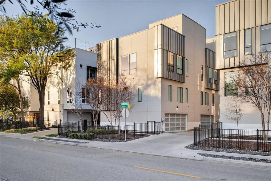 Experience modern city living at its finest in this stunning three-story townhome built in 2017 with NO HOA. Offering over 2,100 square feet of exceptional living space, this contemporary home features sleek designer finishes throughout, including bold hardwood floors, ease of convenience with a central vac & dumb waiter, stylish tile, and an abundance of windows that flood the home with natural light. The gourmet kitchen is beautifully appointed with white shaker cabinetry, stainless steel appliances, a wine fridge, and modern finishes perfect for entertaining or relaxing after a long day. Electric modern shades add both convenience and sophistication. This thoughtfully designed floor plan includes three spacious bedrooms, each with its own private en-suite bath, plus a convenient powder bath for guests. Take the entertaining outdoors to the spectacular rooftop patio where you can enjoy breathtaking views of the Dallas skyline the perfect setting for evening gatherings or quiet mornings with coffee. Located within walking distance to shops, restaurants, and vibrant city life, this home is ideal for the business professional or anyone looking to embrace the energy and lifestyle of Dallas. Location truly says it all—location, location, location.