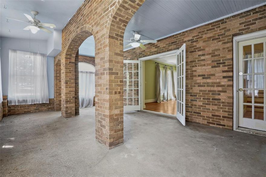 Welcome to this enchanting home with an abundance of space. The entrance leads into a charming brick archway. The beautiful dining room features a crystal chandelier and lovely French doors, making it an ideal space for entertaining. Gleaming hardwood floors flow throughout the home. The large living room includes a fireplace and built-in shelving. The Jack-and-Jill style bathroom connects nicely sized bedrooms.