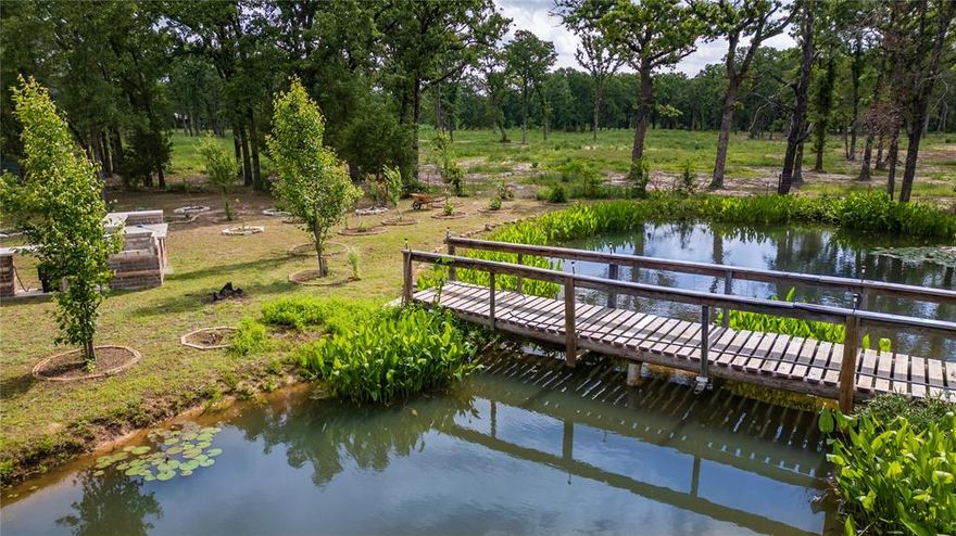 Escape to your own private retreat with this beautiful, heavily treed lot at 424 Hill Ln in Quinlan, TX! This fully fenced property offers the perfect blend of nature and functionality, featuring water and electricity already in place—ready for your dream home, mobile home, or weekend RV getaway.
Enjoy a serene setting with a 12-ft deep pond that is fully stocked with fish, along with a thriving orchard that includes fruit trees, vegetables, and herbs. Whether you’re looking to build, relax, or create a small homestead, this property offers endless possibilities.
Located outside city limits, you’ll appreciate the flexibility and freedom this land provides. With an acceptable offer, the seller is willing to convey select animals, farm and construction equipment, and even the RV currently onsite—making this a truly turnkey opportunity.
Don’t miss your chance to own a versatile no restrictions  piece of land with so much to offer! 
Buyer and buyer’s agent to verify all information, including but not limited to zoning, land use, utilities, restrictions, measurements, schools, and availability of mobile home or RV placement. Information deemed reliable but not guaranteed.