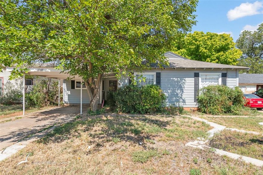 This charming three-bedroom, two-bath home is full of character. The living room has been freshly painted and features stylish new wallpaper that creates a warm, inviting space. Hardwood floors extend through the main living areas, adding timeless appeal. The primary suite offers a private entrance and ensuite bath, providing extra convenience and privacy. Outside, enjoy a covered carport, mature shade trees, and a spacious back patio—perfect for relaxing or entertaining. Additional features include newer kitchen appliances, and a well-maintained HVAC system. Conveniently located near HEB, shopping, and dining, this home combines comfort, style, and everyday practicality.