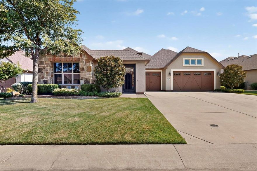 This upgraded Aubrey home with a Casita will check all your boxes. 3 bedrooms and 3.5 baths. The garage measures 31 x 29 and has 8 ft carriage style doors with daylight windows and is fully insulated. The front courtyard has a stamped concrete floor and lots of space for seasonal decorations.   The living room has faux beams, large windows, built in media center, a stone gas fireplace with a heatilator. There is a dry bar with stemware and wine holders. This room is open to the kitchen for easy entertaining. The kitchen features Tacoma Knotty Alder cabinets, quartz counters, an island with seating, gas cooktop, wall oven and Advantium microwave. The sink is granite, there are roll out shelves, undercounter lighting, pendant lights, dovetail drawers and hidden trash and recycle bins. The butler’s pantry is an excellent place to keep all your small appliances, it features a sonic style ice maker. There is a walk-in pantry to top it all off. The dining room overlooks the beautiful backyard with a water feature and privacy shrubs. Wood look tile flooring throughout. The primary bedroom has crown molding, a fan, plantation shutters, tiled shower with niche, medicine chests and framed mirrors. The second primary bedroom has plantation shutters, a walk-in closet, fan, and a tub-shower combo. The 3rd ensuite bedroom is the casita-guest quarters. This is a private room for your guests or in-laws. It has upper and lower cabinets with a counter, a beverage center, tiled shower, closet, fan and door with mini blind inserts.  The office has a built-in cabinet and shelving, a fan, French doors and a double window with pediment. The half bath features tiled wainscotting and full vanity. Now for the outstanding extended back patio. A place where you’ll be proud to invite your guests. There is a brick herringbone floor, plenty of room for chairs and tables, a gas fireplace with heatilator, remote shades, outdoor TV ready, a built in BBQ grill, a fan and recessed lights.