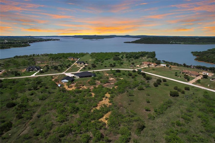This one acre lot overlooking the Possum Kingdom Lake north end is easily accessible with no timeline to build or builder attachment. Mandatory POA membership with ACC oversight. Lot ownership permits the use of all of the neighborhood amenities including; clubhouse with pool and fitness center, boat storage, Courtesy dock, boat ramp, lakeside cabin with restrooms and picnic area, fishing pond, park area, walking trail and twenty miles of private roads behind the gates.