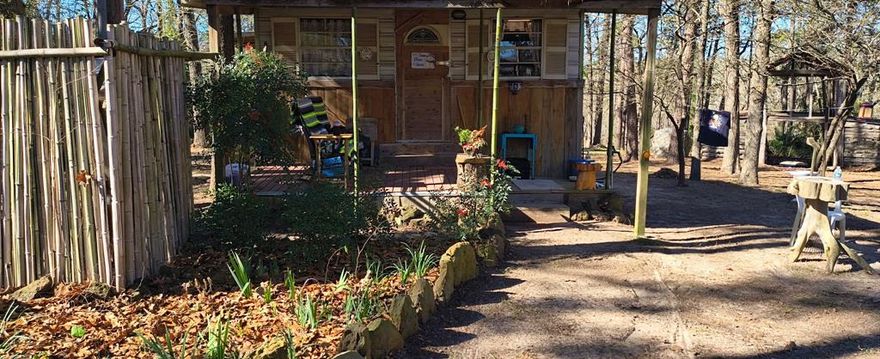 3 acre Hilltop Retreat, Nice Water view overlooking Turtle Bay Cove on Lake Cypress Springs . Small Rustic Cabin with full Bath and walk around deck . Rustic Cedar Barn.. Bamboo Forest and Spring Fed Creek runs all year round. Beautiful Mature Dogwoods all over property and a forest variety of other Trees. Two Road access from Sandy Ln Rd and Sandy Lake Rd. T-post and bamboo fence on one side and creek border on other side . This development is none restricted with no maintenance fees. Farm Animals are allowed. Plenty room to park boat and or a RV.