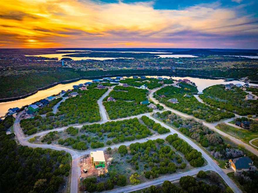 Raw lot primed for a dreamer. This lot is just off the main street, giving the owner privacy, peace, and quiet. Some mature trees could be manicured and incorporated into a great yard or shade. Lot is located sought after area between The Cliffs Marina and the Club House, pool, and restaurant. Be the first person to build on the street. With the right builder, a second floor on this lot could give a great view of the golf course, and a small glimpse of the water inside Neeley's Slough. Ownership gives access to many amenities; 18-hole Championship Golf Course, Chaparral Grille and Spurs Bar, Marina and Ship Store, Hotel, Conference Center, Spa, Fitness Center, 2 Swimming Pools, Tennis Courts, Playground, Parks and more. Owners receive 36 complimentary rounds of golf per year. This is a gated and guarded community, so contact an agent to schedule a time to get access and tour The Cliffs Resort.