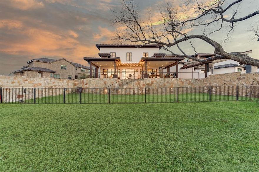 Luxury Lakeside living at its finest!!! Located in the only 24-7 gated and guarded golf course community on Eagle Mountain Lake! This is a property as close to turnkey as they come! Timeless updates from top to bottom and meticulous attention to every detail by the owner, the only renovations needed are switching out the current owners clothes with your own, it's ready to go! The first floor is made to entertain, a Sonos music system to create the environment, flawless handscraped oak floors throughout, three sets of stately iron glass doors with electric shades overlooking your beautiful waterfront view with a hidden doggie door. The kitchen has a built in commercial grade fridge, Thermador gas cooktop, instant hot water under sink, and oversized walk in pantry with a secondary laundry area as well. The second floor features all three bedrooms each having their own en suite bath, an office space with built in desk and iron doors, and separate sitting. The master suite overlooks the lake with a large en suite bath complete with a steam shower and huge custom closet that leads directly to the main laundry room. Take the stairs or use the elevator that will take you to all three floors, the third floor features a walk-in attic with 400 square feet of floor space. The three car tandem garage is extra wide with epoxy flooring. Enjoy the ultimate entertaining experience on the back patio that has two covered patios with evaporative swamp coolers, mosquito misting system installed, privacy shutters on the ends of the patio, and lawn and plants are on an automated water system. This home also has it's own boat slip just steps away!!! Available for purchase separately for the new owner. This neighborhood can't be beat - amenities include an 18-hole golf course, clubhouse with restaurant and bar, two pools, fitness center, basketball and pickle ball court, beach area, boat ramp, playground, and the list goes on!