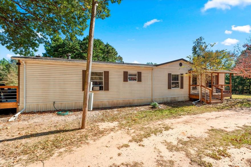 Private 6.75-Acre Retreat with Updated 3BR and 2BA Home – Move-In Ready! Discover the perfect blend of privacy and comfort on this beautiful 6.75-acre property, featuring a remodeled 3-bedroom, 2-bath home surrounded by a mix of cleared land and mature woods. The open, usable acreage offers space for a garden, animals, or future expansion, while the wooded areas provide natural beauty and seclusion. Inside, the home has been thoughtfully updated with modern finishes and is completely move-in ready- comes furnished—just bring your bags! Enjoy peaceful country living with room to roam, all while being a short drive to town conveniences.