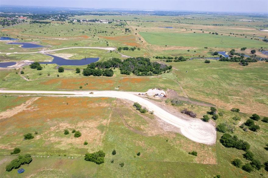 Come & build your dream home on this beautiful lot in the highly sought after Aledo ISD! Ideally located just 15 minutes to Fort Worth, 15 minutes to downtown Weatherford and 30 minutes to DFW Airport. This property offers a unique blend of natural landscapes with beautiful water features, rolling terrain, and various elevations, presenting a perfect canvas for your dream home. The property's topography provides a picturesque base for designing a home that fully utilizes the natural contours and panoramic views of the property. AT&T Internet being installed.  Propane tanks must be buried

With its proximity to both Fort Worth & Weatherford, you have the convenience of city amenities like shopping, dining, and entertainment just a short drive away, while still enjoying the tranquility and privacy that country living provides.

Lakeridge Ranches offers a rare blend of convenient location and natural beauty. Don’t miss this unique opportunity!!