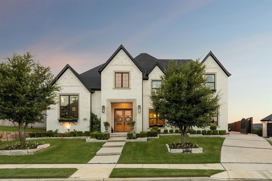 Welcome to an unparalleled blend of craftsmanship, elegance, and everyday comfort in this one-of-a-kind Jeff Pfeifer estate, nestled at the end of a private cul-de-sac in the prestigious Saddle Creek community of Prosper. Constructed in 2019, this 5,025-square-foot architectural masterpiece sits on a beautifully manicured 0.316-acre lot, perfectly balancing refined luxury and inviting livability.Step inside to discover incredible white oak natural hardwood floors , intricate crown molding, soaring vaulted ceilings, and an abundance of natural light flooding in through expansive windows. Every detail exudes timeless sophistication—from designer finishes and exquisite built-ins to custom granite accents that elevate the entire aesthetic. This thoughtfully designed 5-bedroom, 7-bathroom residence is crafted for discerning tastes, with open-concept living spaces that flow effortlessly to suit both intimate gatherings and grand entertaining. A hidden media room adds an exclusive touch of sophistication, while generous walk-in closets in every bedroom ensure both style and practicality. The chef-inspired kitchen, perfectly positioned between the main living and dining areas, serves as the heart of the home and opens seamlessly to an outdoor haven. Step outside to experience your private resort-style oasis, where a luxurious pool, state-of-the-art outdoor kitchen, and professionally landscaped surrounds create the ultimate setting for endless summer days and star-lit evenings.
Additional highlights include a spacious 3-car garage with an extended driveway ensuring convenience for family and guests, along with a smart layout that offers both privacy and functionality throughout. More than just a home, this estate is a bold statement of style and comfort in one of Prosper’s most coveted neighborhoods.Indulge in the art of elevated living and make this extraordinary home your own.