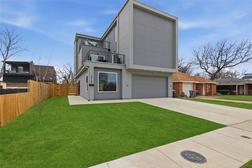 Welcome to 1810 Kraft Street! This one of a kind modern contemporary designed home is nestled in Trinity Groves and just minutes away from American Airlines Center, Bishop Arts, and the Design District. Laminate flooring throughout the whole home, no carpet! 2 secondary bedrooms and a bathroom are also on the first floor. The second floor is the heart of the home which boasts a stunning kitchen with a 14-foot granite waterfall island, equipped with state-of-the-art appliances, this kitchen is a chef's dream. Ample cabinetry and pantry space to ensure all your storage needs are met. The kitchen seamlessly connects to a bright living room with 18-foot ceilings and numerous windows, flooding the space with natural light, luxury lighting and a 70 inch fireplace. A charming balcony extends off the living room, and provides access to the 2nd floor guest bedroom. This floor also includes a well appointed full bathroom and a convenient laundry room. The primary retreat is on the 3rd level and is spacious and bright. It includes a cozy seating area for relaxation which could also be used as an office space, and opens to the balcony where you can enjoy even more great views of downtown! The luxurious ensuite bathroom has dual vanities, a modern free standing soaking tub, and a 2 sided shower offering a spa-like feel. This home is thoughtfully designed to accommodate a rooftop deck, providing an incredible opportunity for outdoor living and entertaining! A full water filtration system also is installed on the home, security system and alarm, new modern front door installed.