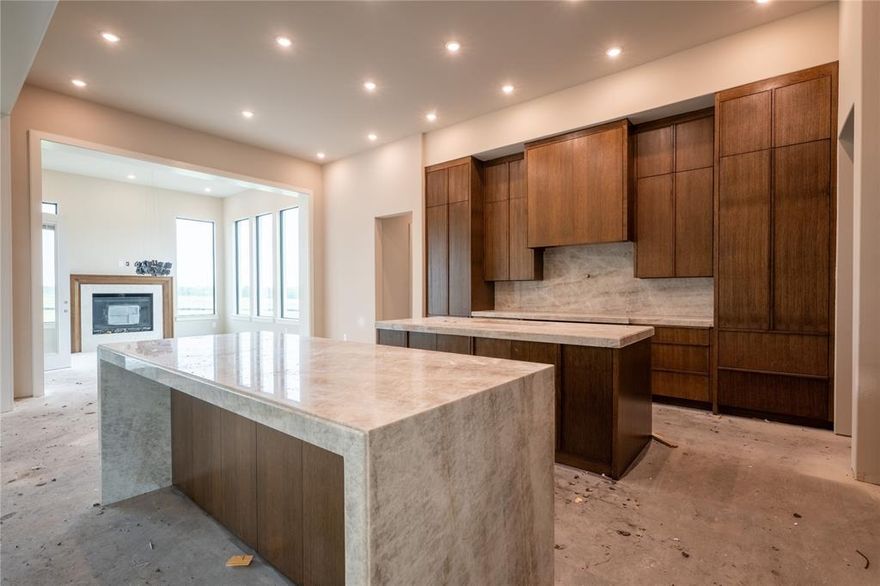 Set on more than an acre, this custom Haynes Homes estate spans 5,600 square feet and welcomes you with a grand front courtyard and an open foyer filled with soft natural light from the floor to ceiling steel windows. The first floor offers impressive living spaces, including a great room with tall windows, a kitchen that opens to the outdoor living area through a large metal sliding door, a warm hearth room with a fireplace, two private studies, a media room, and a large walk-in pantry with a butler’s pantry. The primary suite feels like a private retreat with a spacious bedroom, a spa bath, and a walk-in closet that connects directly to the laundry room. Three more first-floor bedrooms each feature their own elegant private bath. The three-car garage includes a built-in safe room, and the upstairs area adds a game room, a bedroom, and a full bath for extra comfort and space. The property has no HOA and no city taxes, offering more freedom and lower carrying costs.

$10,000 buyer credit available if preferred lender is used.