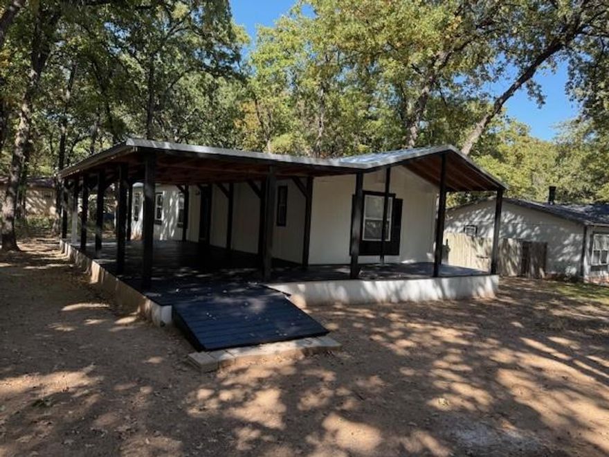 Adorable Move -In Ready Lake This Granbury property is located on the Ft Worth side of town, the three-bedroom, two bathrooms has an open-floor, split-bedroom home is in the Acton School District. The mature tree in the front yard provides shade for the home and massive, covered porch. The large lot and carport and nice sized shed allow this home to be the perfect home. The backyard is fenced for kiddos or pets. The home has new title flooring in all.