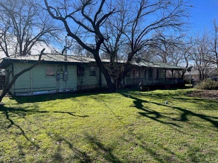 Beautiful .33 acre lot with older mobile home that has been added on to. House needs some TLC, the green house and large shop all on cement slab that needs to probably be rebuilt as well but can do down the road. Great place to rebuild a home or have a rental. Seller says bring on all offers.