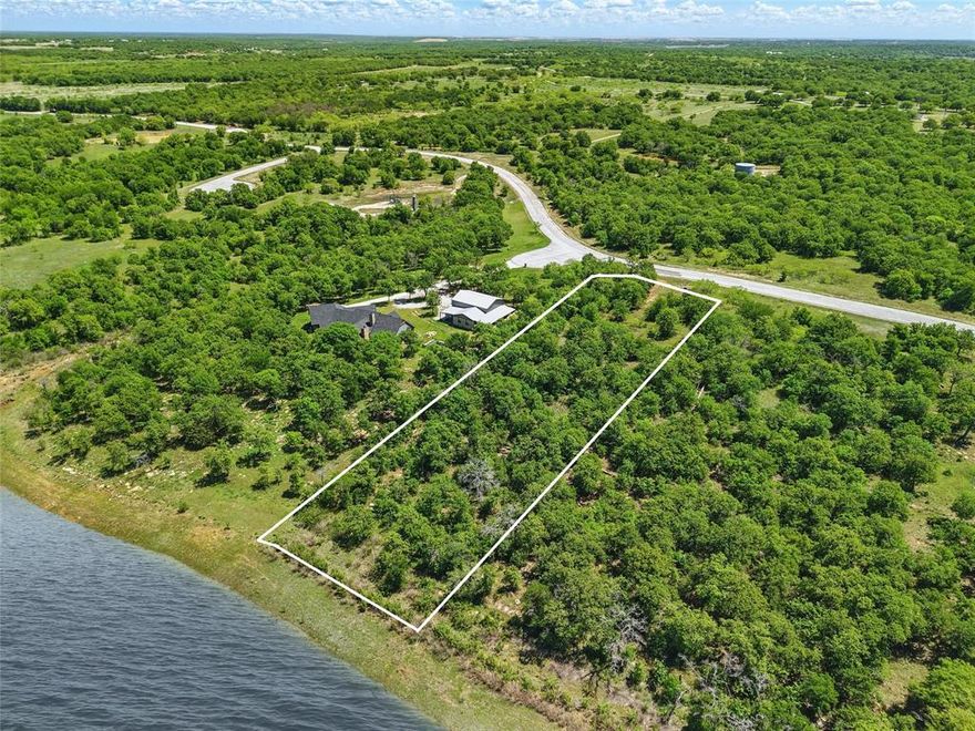 Dreaming of the Lake Life this summer?  This 86ft of lake frontage is ready for you to bring your own builder! The gated community of North Star Pointe is located on Lake Bridgeport, a sprawling 1,200-acre lake, you’ll enjoy stunning water views and direct access to endless recreational adventures. 

This exceptional property features underground utilities (electrical), paved streets, and secure gated access. This beautifully treed lot also has unique rock formations and beautiful views. Spend your days boating, fishing, or kayaking right from your lot, then unwind at the community pool or challenge friends to a game of pickleball on the community courts. Neighborhood also includes a boat ramp if you choose not to build your own dock. 

Conveniently located just an hour from the Alliance area, this is your opportunity to embrace the lakefront lifestyle you’ve always envisioned. 

Financing options available. Neighborhood does have restrictions.