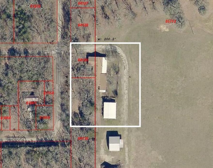 Beautiful 1.5 acres with a large 3700 Square foot home that needs a complete remodel. It is partially treed with a beautiful view home has been empty for several years. It will also come with a large rv carport that has a concrete floor.