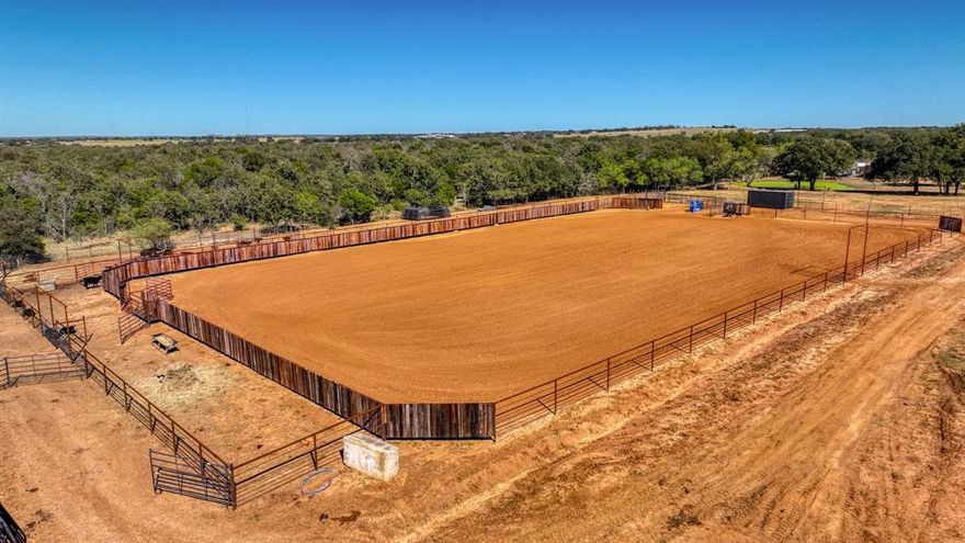 This property carries undeniable value with its easily accessible location just off US Hwy 281. Set on 48.5 acres, the drive through the property takes you past a fully stocked pond and peaceful hunting area, often home to grazing deer, before arriving at the beautiful Austin Stone residence and professionally designed training complex.

The facility is thoughtfully designed for flexibility and functionality, featuring 35 large stalls that can be easily divided into up to 80 smaller stalls, allowing the layout to adapt to a variety of operational needs. Additional improvements include six covered turnout runs, four fully fenced pastures, a covered round pen with premium footing, a 150’x250’ roping arena, five pipe cattle pens (two with automatic waterers), three 50-amp RV hookups, a dedicated shavings storage barn, gated entrance, and more.

Constructed in 2024, the main barn offers a 3-horse wash bay, LED lighting throughout, and a beautifully finished programmable 6-horse Priefert panel walker. A dedicated 30’x80’ equipment storage barn provides ample space for trailers, tractors, and operational equipment. The second barn includes 10 additional stalls with a concrete alley, wash bay, and six covered runs, making it ideal for show horses, mares, or yearlings, with convenient access to the roping arena and cattle pens.

Follow the long, scenic drive to the secluded 2,700+ square foot residence, offering a comfortable retreat after full days around the facilities. The home features four bedrooms, three and a half baths, an oversized two-car garage, granite countertops, a spacious kitchen island, gas stove, versatile office or dining space, and a cozy rock fireplace. Step outside to the covered back patio, wired for an outdoor TV, and enjoy views of tree-lined pastures and a rock fire pit — the perfect setting to unwind or entertain.